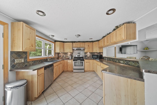 4787 Hooks Mill Rd, Adrian, MI 49221 - kitchen featuring appliances with stainless steel finishes, a textured ceiling, light brown cabinetry, dark countertops, and backsplash