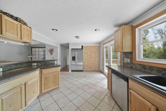 4787 Hooks Mill Rd, Adrian, MI 49221 - kitchen featuring stainless steel appliances, dark countertops, light brown cabinetry, a textured ceiling, and recessed lighting