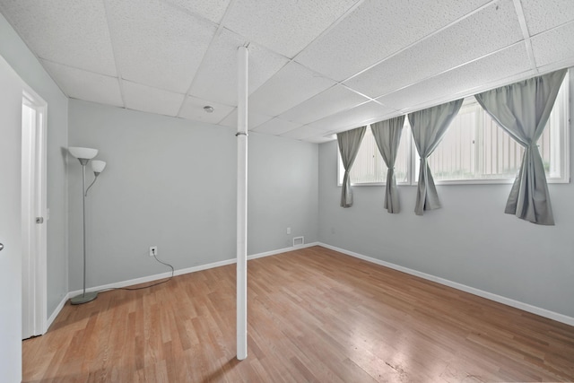 4787 Hooks Mill Rd, Adrian, MI 49221 - below grade area featuring a paneled ceiling and wood finished floors