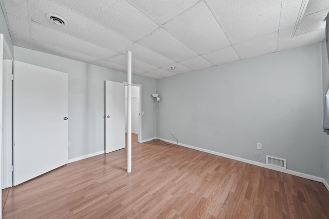4787 Hooks Mill Rd, Adrian, MI 49221 - finished basement with light wood-style flooring and a drop ceiling