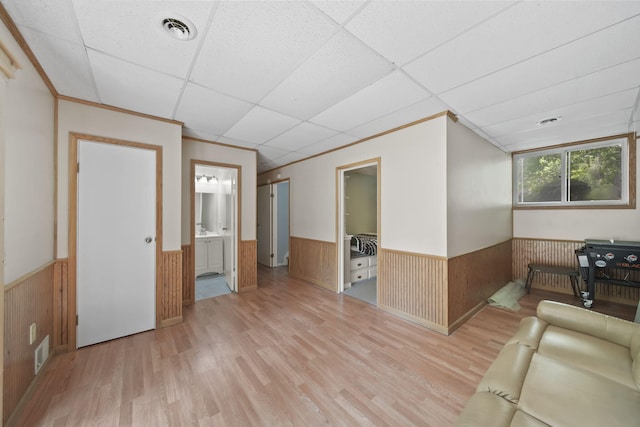 4787 Hooks Mill Rd, Adrian, MI 49221 - living room with wainscoting, light wood-type flooring, wood walls, and a paneled ceiling