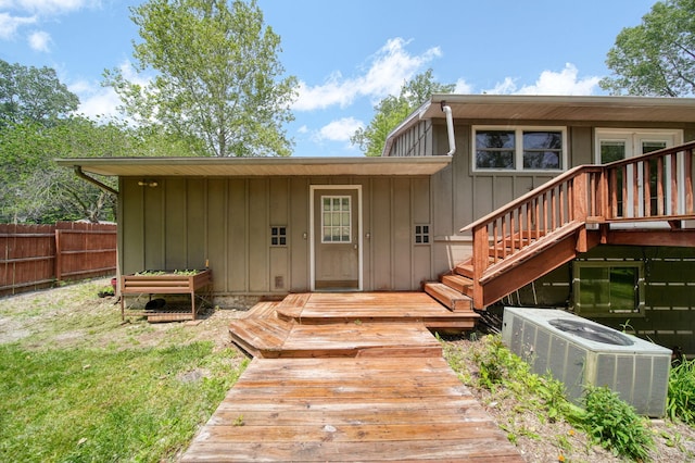 4787 Hooks Mill Rd, Adrian, MI 49221 - view of exterior entry featuring board and batten siding and a wooden deck