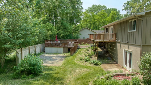 4787 Hooks Mill Rd, Adrian, MI 49221 - fenced backyard featuring a deck and french doors
