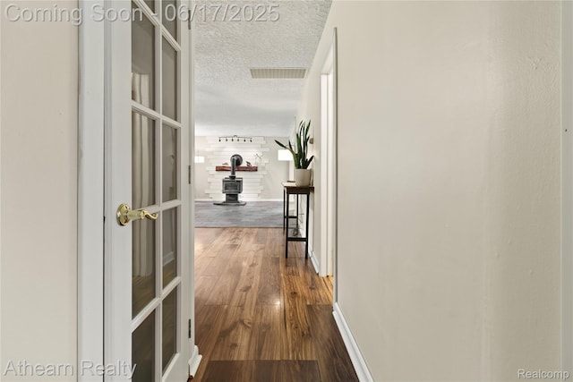 10129 Nimphie Rd, Fenton, MI 48430 - hall featuring a textured ceiling and dark wood-type flooring