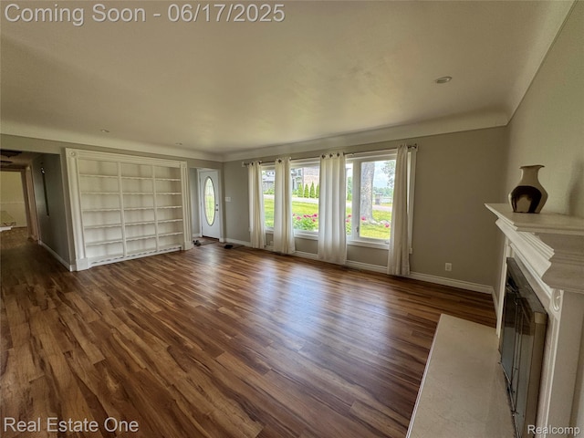 3340 Chickering Ln, Bloomfield Hills, MI 48302 - unfurnished living room with wood finished floors, built in features, and a fireplace with flush hearth
