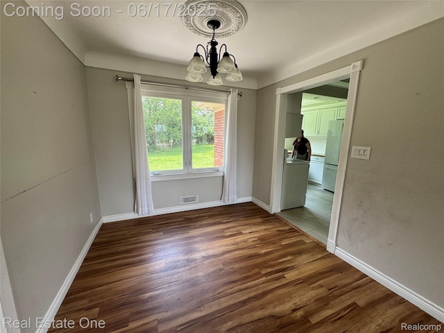 3340 Chickering Ln, Bloomfield Hills, MI 48302 - unfurnished dining area featuring a chandelier and wood finished floors