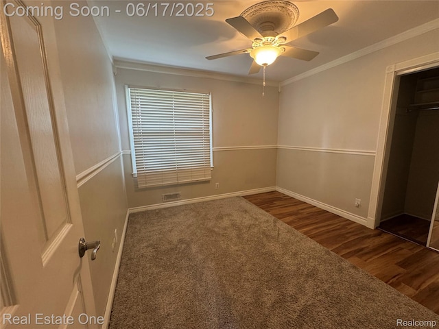 3340 Chickering Ln, Bloomfield Hills, MI 48302 - unfurnished bedroom featuring dark wood-style floors, ornamental molding, and a ceiling fan