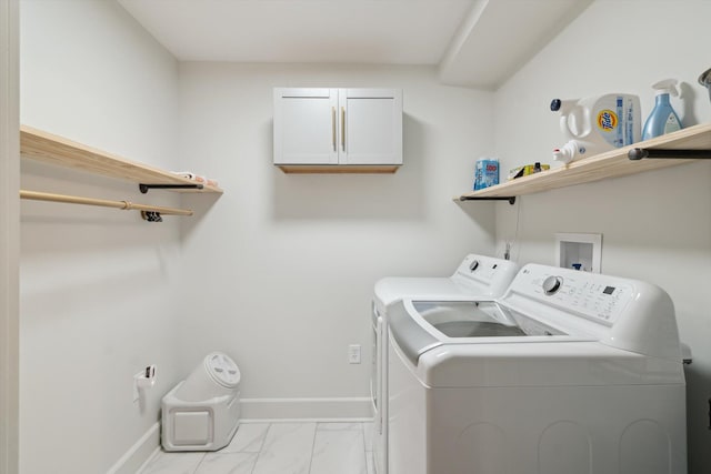 217 S Marshall Ave, Marshall, MI 49068 - washroom featuring separate washer and dryer, marble look tiles, and cabinet space