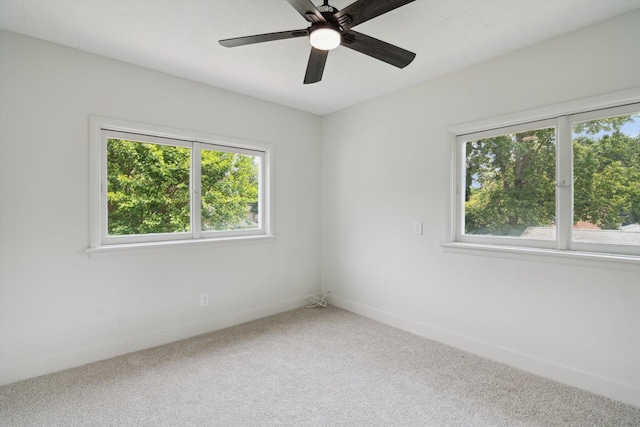 217 S Marshall Ave, Marshall, MI 49068 - unfurnished room featuring plenty of natural light, carpet floors, and ceiling fan