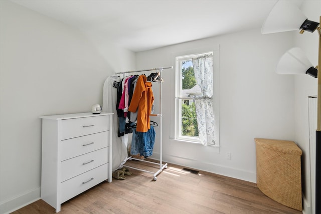 217 S Marshall Ave, Marshall, MI 49068 - bedroom with light wood finished floors and baseboards