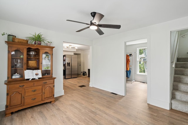 217 S Marshall Ave, Marshall, MI 49068 - empty room featuring stairway, ceiling fan, and light wood-style floors