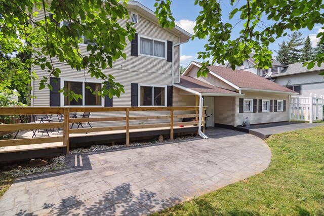 217 S Marshall Ave, Marshall, MI 49068 - view of front of house with a wooden deck and a patio area