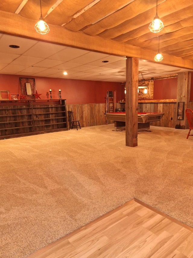 624 N Main St, Evart, MI 49631 - finished basement featuring billiards, a wainscoted wall, carpet, wooden walls, and wood finished floors