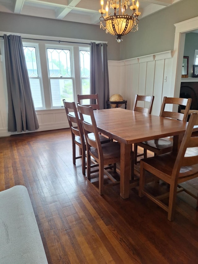 624 N Main St, Evart, MI 49631 - dining room featuring dark wood finished floors, a decorative wall, a chandelier, wainscoting, and beamed ceiling
