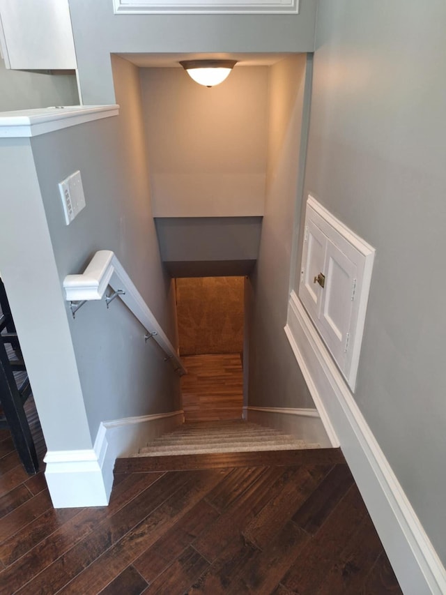 624 N Main St, Evart, MI 49631 - stairs featuring wood finished floors and baseboards