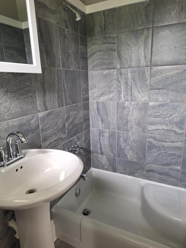 624 N Main St, Evart, MI 49631 - bathroom featuring bathtub / shower combination and tile walls