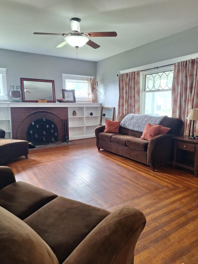 624 N Main St, Evart, MI 49631 - living area with a fireplace and ceiling fan