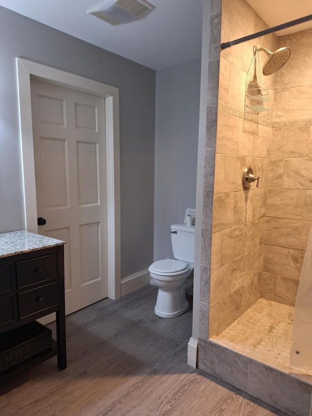624 N Main St, Evart, MI 49631 - bathroom with a shower stall, wood finished floors, and vanity