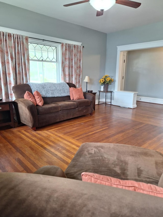 624 N Main St, Evart, MI 49631 - living area with ceiling fan and wood finished floors