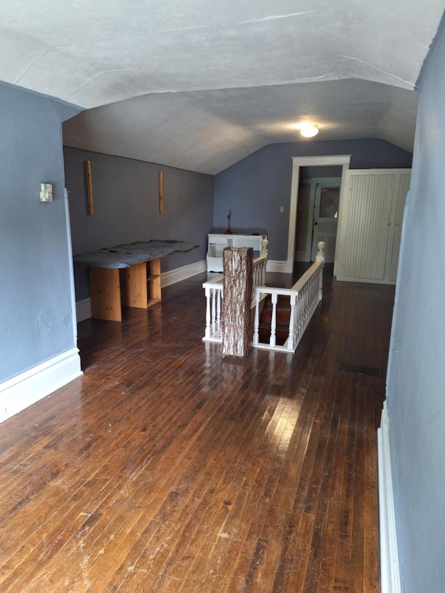 624 N Main St, Evart, MI 49631 - bonus room featuring vaulted ceiling and hardwood / wood-style floors