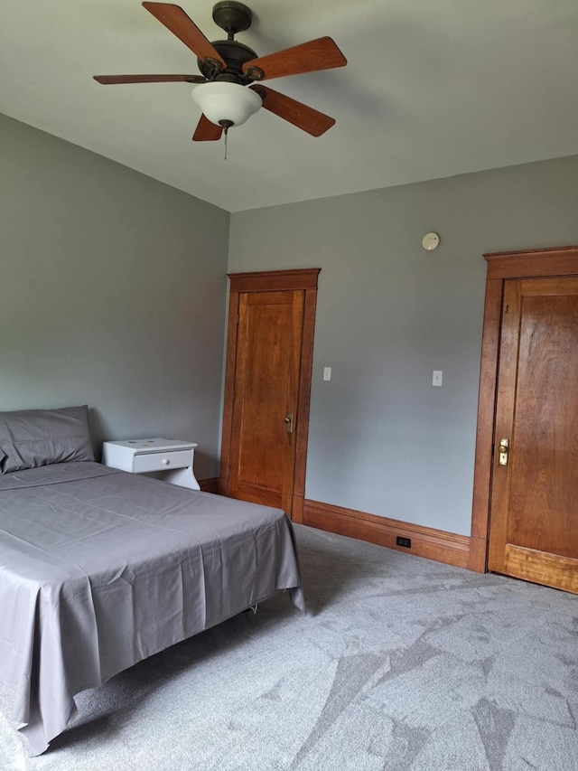 624 N Main St, Evart, MI 49631 - carpeted bedroom with a ceiling fan