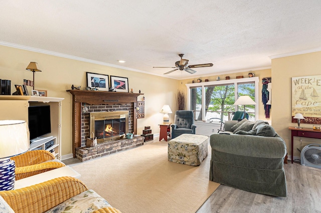 8870 W School Section Lake Dr, Mecosta, MI 49332 - living room with ornamental molding, a fireplace, ceiling fan, and wood finished floors