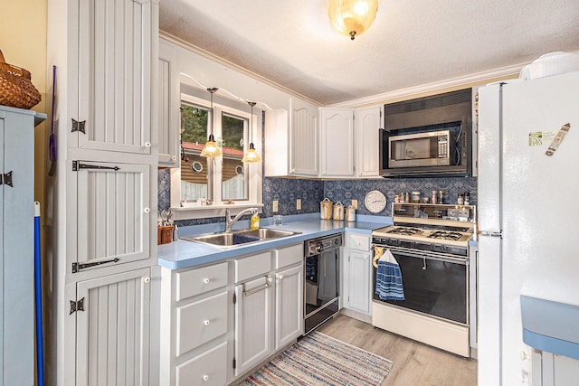 8870 W School Section Lake Dr, Mecosta, MI 49332 - kitchen featuring white appliances, light wood-style floors, tasteful backsplash, light countertops, and white cabinetry