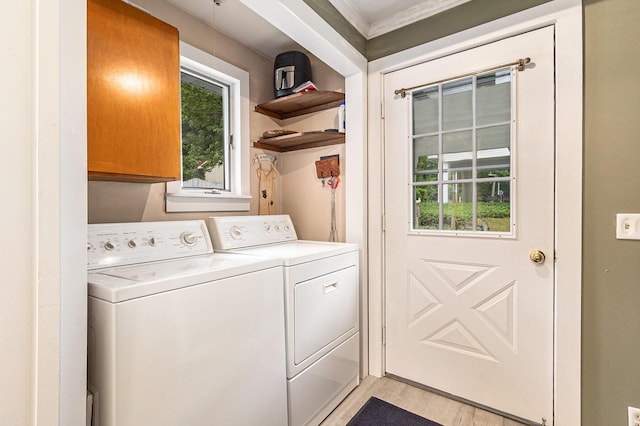 8870 W School Section Lake Dr, Mecosta, MI 49332 - laundry area with cabinet space, washing machine and dryer, light wood-type flooring, and ornamental molding