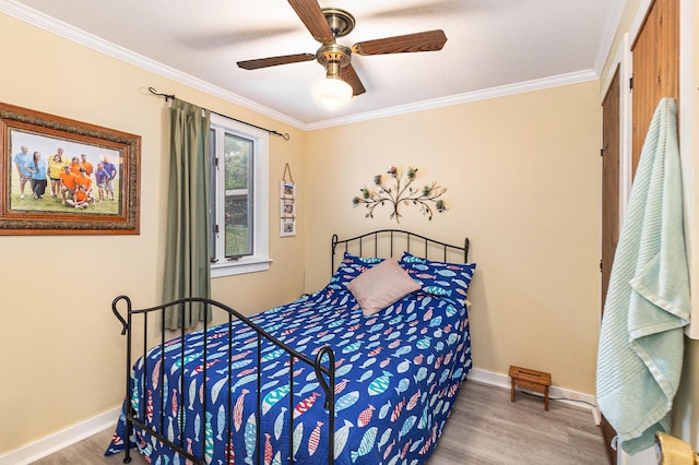 8870 W School Section Lake Dr, Mecosta, MI 49332 - bedroom featuring wood finished floors, ornamental molding, and ceiling fan