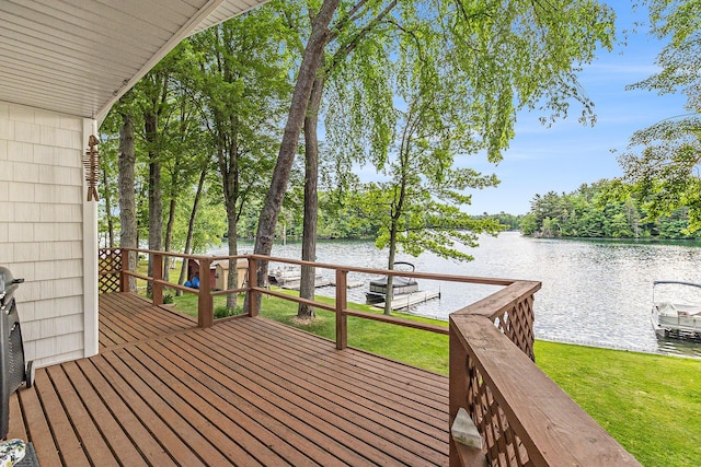 8870 W School Section Lake Dr, Mecosta, MI 49332 - deck with a water view and a lawn
