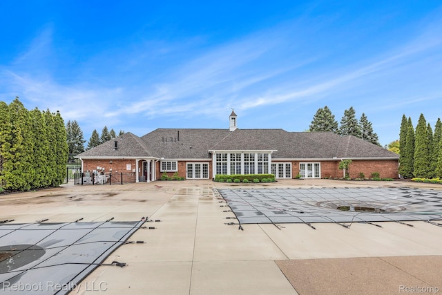 6548 Shetland Ct, Shelby Twp, MI 48316 - view of swimming pool with french doors, a covered pool, and a patio area