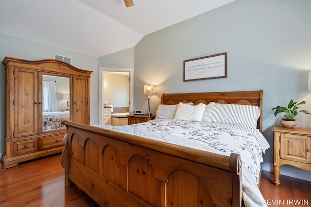 19223 Fox Glove Cir, Big Rapids, MI 49307 - bedroom featuring lofted ceiling, hardwood / wood-style floors, connected bathroom, and ceiling fan