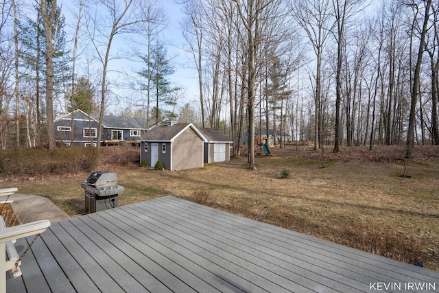 19223 Fox Glove Cir, Big Rapids, MI 49307 - wooden terrace with a playground and a storage shed