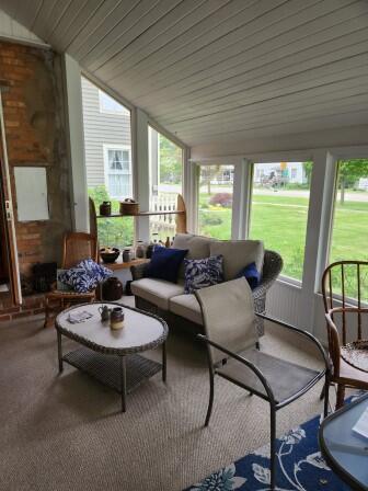 44 N Main St, Quincy, MI 49082 - sunroom featuring plenty of natural light, lofted ceiling, and an outdoor living space