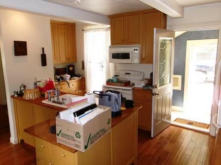 44 N Main St, Quincy, MI 49082 - kitchen with white appliances and wood finished floors