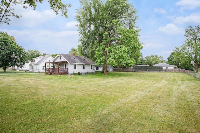 8464 E Michigan Ave, Galesburg, MI 49053 - fenced backyard featuring a deck