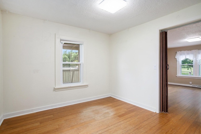 8464 E Michigan Ave, Galesburg, MI 49053 - spare room with light wood finished floors and a textured ceiling