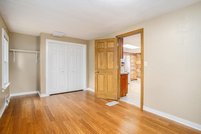 8464 E Michigan Ave, Galesburg, MI 49053 - unfurnished bedroom featuring light wood-style flooring
