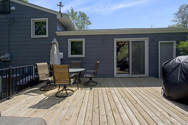 8683 Hemlock Ct, Ypsilanti, MI 48198 - wooden terrace with outdoor dining space