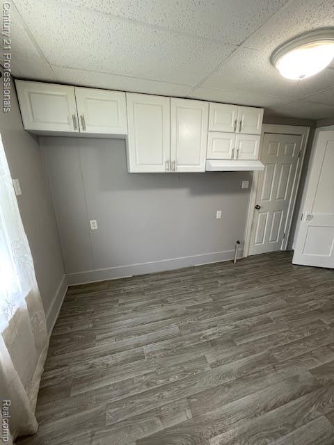 2135 Jarvis Ave, Warren, MI 48091 - kitchen with white cabinets, dark wood-style floors, and a drop ceiling