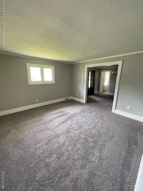 2135 Jarvis Ave, Warren, MI 48091 - spare room with crown molding and carpet floors