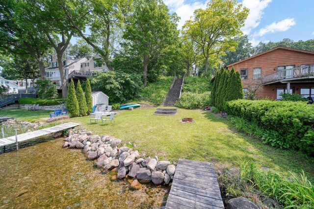 5027 Belemere Ct, Manitou Beach, MI 49253 - view of green lawn featuring a shed