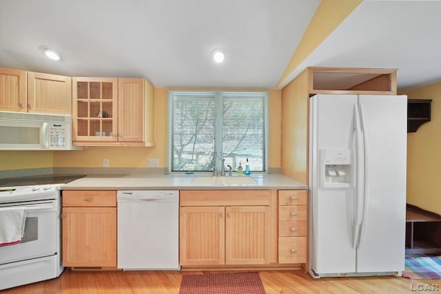 5027 Belemere Ct, Manitou Beach, MI 49253 - kitchen featuring white appliances, light brown cabinetry, light countertops, lofted ceiling, and recessed lighting