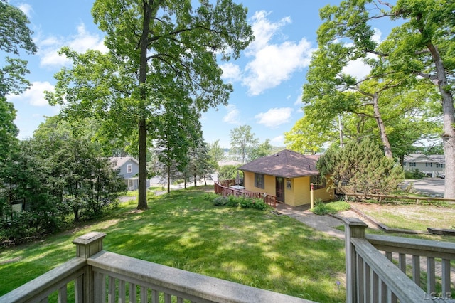 5027 Belemere Ct, Manitou Beach, MI 49253 - view of grassy yard featuring a wooden deck