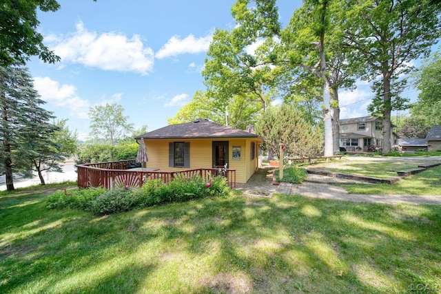 5027 Belemere Ct, Manitou Beach, MI 49253 - back of property with a yard and a wooden deck