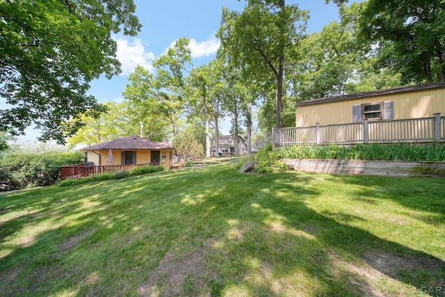 5027 Belemere Ct, Manitou Beach, MI 49253 - view of grassy yard featuring a wooden deck