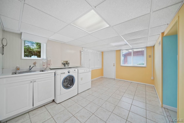 5027 Belemere Ct, Manitou Beach, MI 49253 - laundry room with washing machine and clothes dryer, cabinet space, and light tile patterned flooring