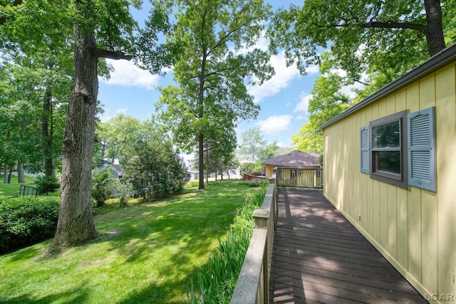 5027 Belemere Ct, Manitou Beach, MI 49253 - view of grassy yard with a deck