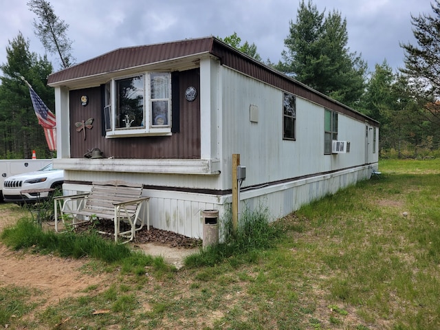 4540 Chalker Rd, Wellston, MI 49689 - view of side of home with cooling unit and a lawn