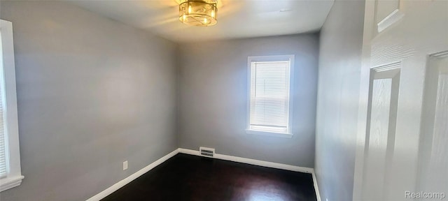 18978 Indiana St, Detroit, MI 48221 - unfurnished room with baseboards and dark wood-type flooring